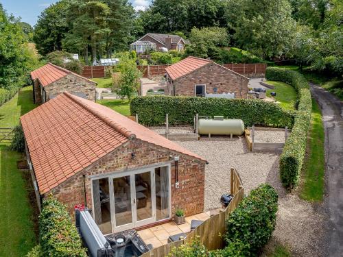 an aerial view of a house with a garden at The Chicken Coop in Fulletby