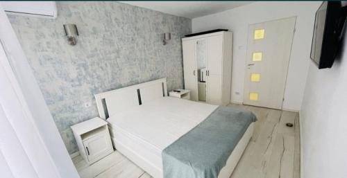 Ένα ή περισσότερα κρεβάτια σε δωμάτιο στο Apartament Elegant & Central Complet Utiliat Self check-in