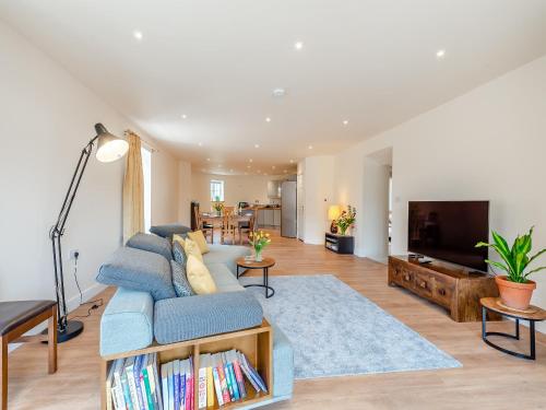 a living room with a couch and a tv at The Oast - Uk43087 in Preston