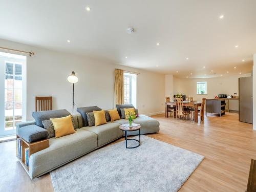 a living room with a couch and a table at The Oast - Uk43087 in Preston