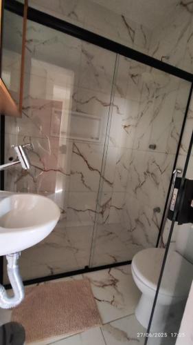 a bathroom with a sink and a toilet at Studio Figueira, Flor in Santarém