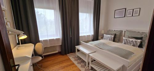 a hospital room with a bed and a window at 3BR - Bremerhaven Apartment in Bremerhaven