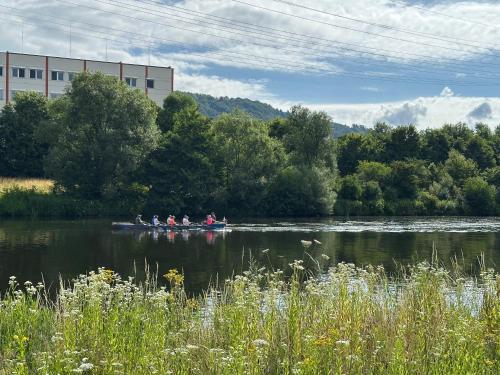 a group of people in a boat on a river at Große Ferienwohnung Gästehaus NEUBAU Merzig 120m2 in Merzig