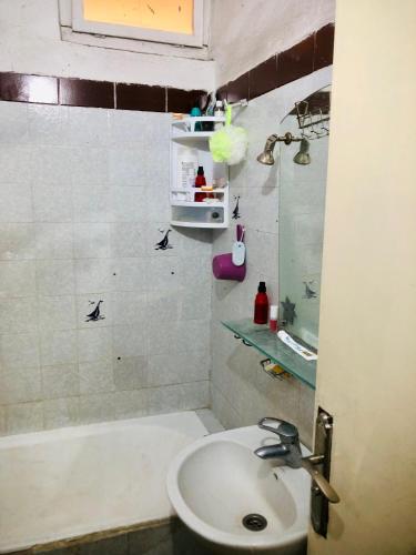 a bathroom with a sink and a bath tub at Cyrnos in Fez