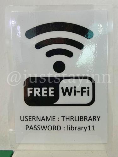 a sign that says free wifi on a wall at Just Stay-Inn Guesthouse The Heights Residence Melaka in Ayer Keroh