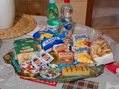 a table with a tray of food and drinks at La Residenza Del Vescovo in Stimigliano