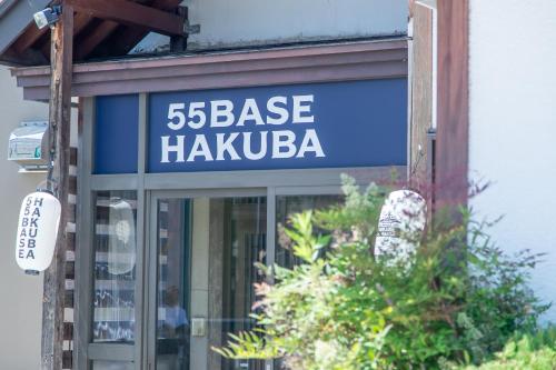 a sign that base hakkaarma on a building at 55BASE Hakuba in Hakuba
