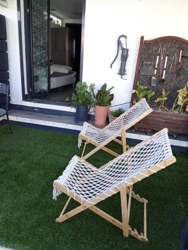 two wicker chairs sitting on a porch at STUDIO Perpignan in Perpignan