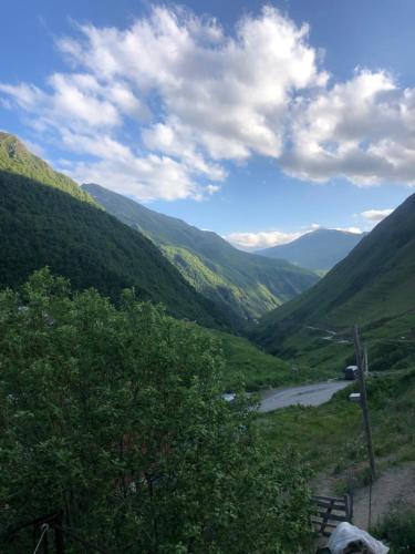 a view of a valley with a river and mountains at Levan & Megi in Jut'a