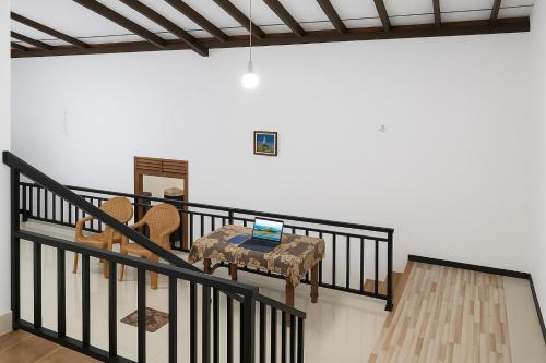 a room with a table with a laptop on it at galle villa in Galle