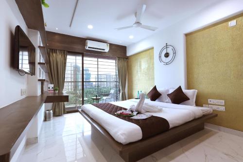 Ένα ή περισσότερα κρεβάτια σε δωμάτιο στο Corporate Apartment - Gagal Home