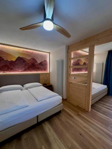 Ένα ή περισσότερα κρεβάτια σε δωμάτιο στο Hotel Denny