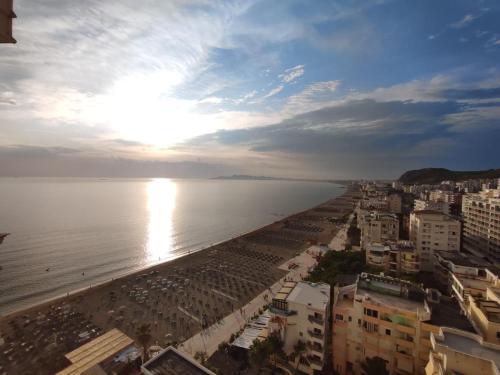 a view of a beach with buildings and the ocean at Beachfront Marilyn in Durrës