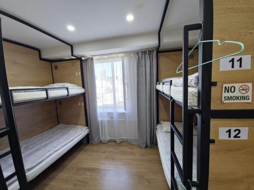 Кровать или кровати в номере Central Guest House