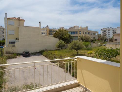 a balcony with a view of a parking lot at Roof Top Apartment By Athens Airport in Spáta