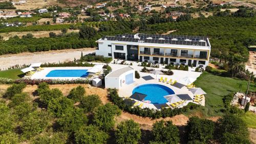 an aerial view of a house with a swimming pool at Orange Grove Residence in Silves