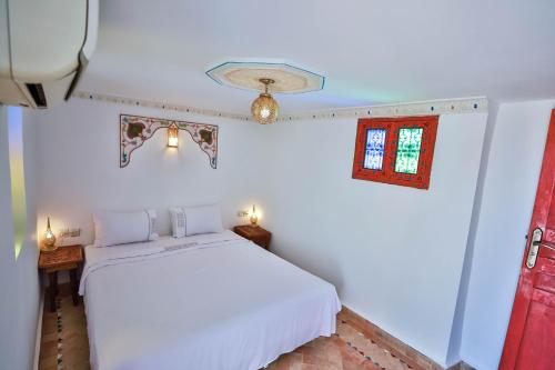 Cama ou camas em um quarto em Riad Fez Unique