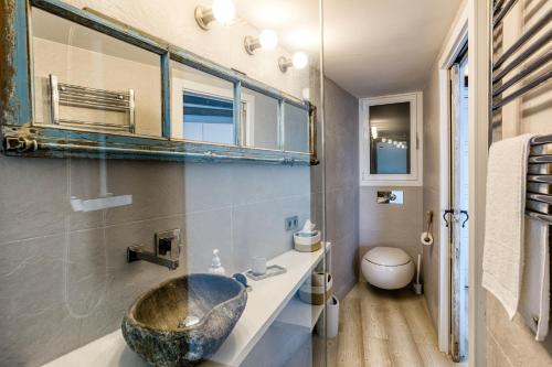 a bathroom with a large bowl sink in it at Exclusivo Loft En Cap Sa Sal in Begur