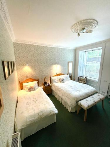 Ένα ή περισσότερα κρεβάτια σε δωμάτιο στο Rockhill Guest House