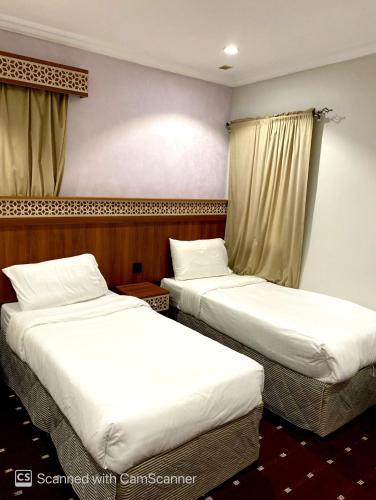 Voodi või voodid majutusasutuse فندق مواسم الخير الدولية toas