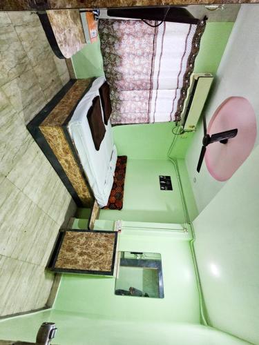 an overhead view of a room with a sink and a mirror at Sai Lodge in Parbhani