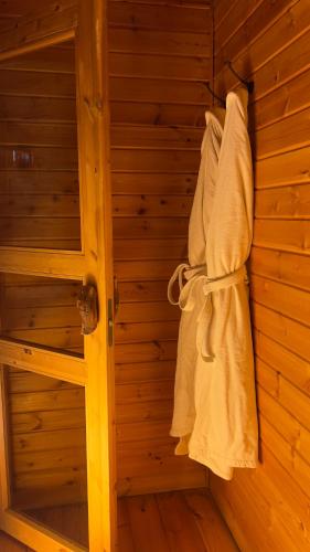 a sauna with white towels hanging on a wall at פסגת מתת Pisgat mattat in Mattat