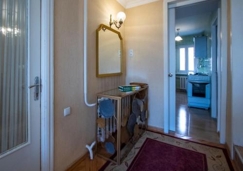 a room with a hallway with a sink and a mirror at Cozy House And Yard Old Tbilisi Center in Tbilisi City