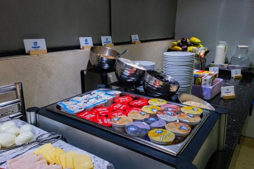 a table with food on a counter in a kitchen at Holiday Inn Express Mexico Reforma by IHG in Mexico City