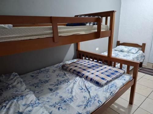 a bedroom with two bunk beds in a room at Hostel gru Airport in Guarulhos