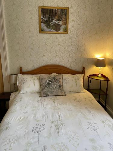 Ένα ή περισσότερα κρεβάτια σε δωμάτιο στο Rockhill Guest House