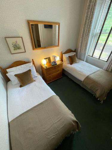 Ένα ή περισσότερα κρεβάτια σε δωμάτιο στο Rockhill Guest House