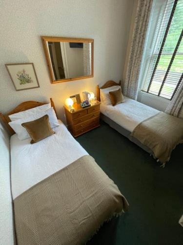 Ένα ή περισσότερα κρεβάτια σε δωμάτιο στο Rockhill Guest House