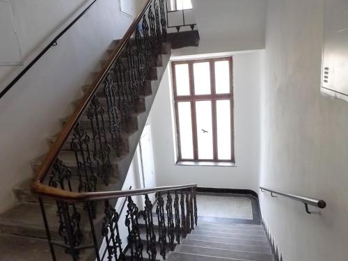 a staircase in a building with a window at Friends on the Road D4 Prague in Prague