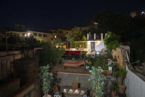 a view of a rooftop patio at night at In Centro a Certaldo in Certaldo