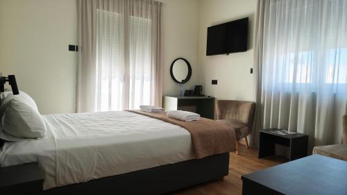 Postel nebo postele na pokoji v ubytování St Lazarus City Hotel