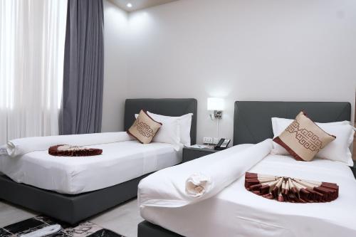 Ένα ή περισσότερα κρεβάτια σε δωμάτιο στο Adden City View Hotel