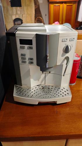 a coffee maker sitting on top of a table at Árpád Ház in Alsónána