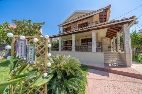 a house with a gate in front of it at Melitini's Villa in Argostoli