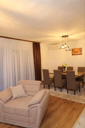 a living room with a couch and a table at Vikendica Sara in Šipovo