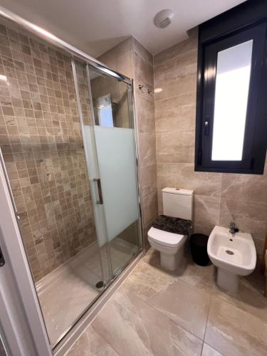 a bathroom with a shower and a toilet at Apartment in campello Beach in El Campello