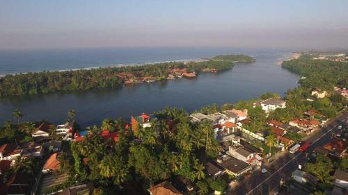 an aerial view of a river with houses and trees at Ranga Holiday Resort in Bentota