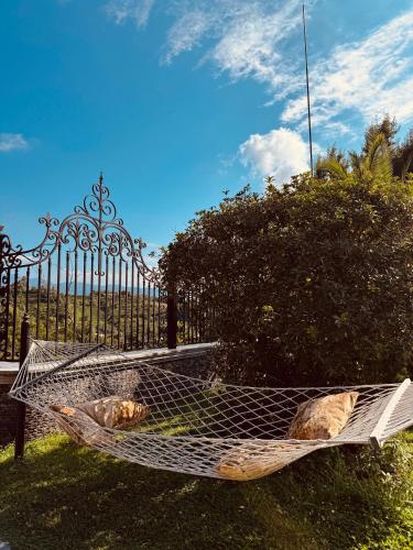 a hammock in front of a wrought iron fence at Green villa panorama in Batumi