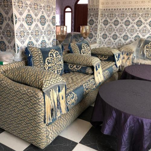 a living room with a couch and a table at Cabo Air in Cabo Negro