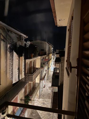 a view of an alley at night from a balcony at Alloggio Turistico Marin Valley in Fondi