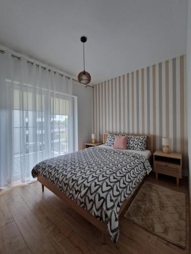 Katil atau katil-katil dalam bilik di Apartament Paderewskiego Two Bedrooms Private Garage FV Self Check-in