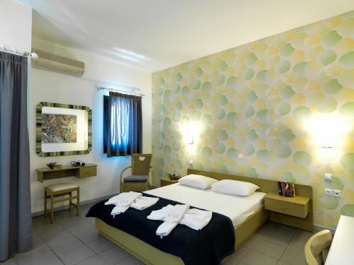Ένα ή περισσότερα κρεβάτια σε δωμάτιο στο Elia Apartments