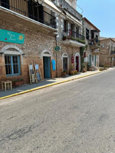 an empty street in front of a brick building at Petreas Studio in Kardamili