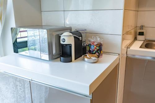 a kitchen with a coffee maker on a counter at Luxury House con WiFi and free parking in Trezzano sul Naviglio