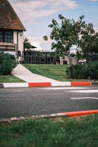 a red and white curb on the side of a street at The Stag Rooms in Stratford-upon-Avon