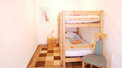 a bedroom with bunk beds and a checkered floor at Lerchenhof in Friesach